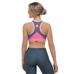 soutien gorge de sport violet rose design avec à l'arrière le logo de couleur blanc vue de dos